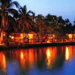 Scaravelli inspired yoga retreat holiday with Catherine Annis in Kerala India nightime river and villas